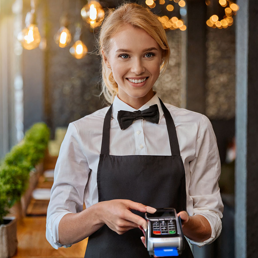 happy waiter using contactless payment solution