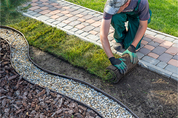 landscaper working in field residential