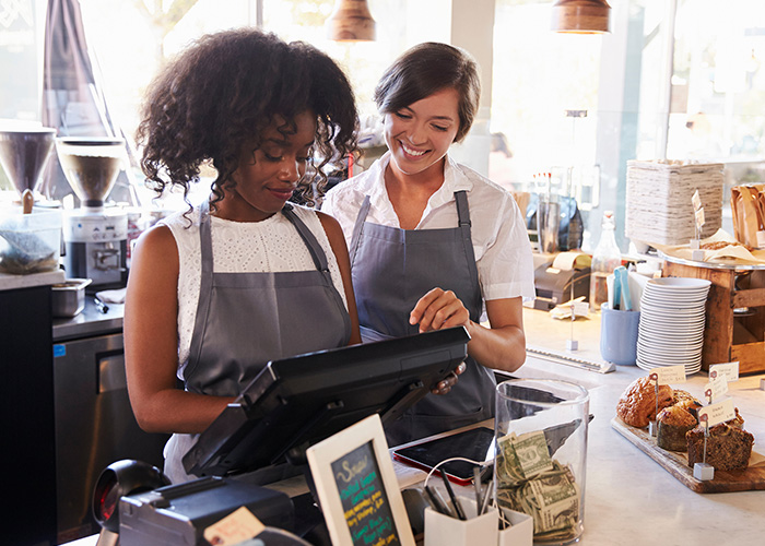 Business employees using point of sale system