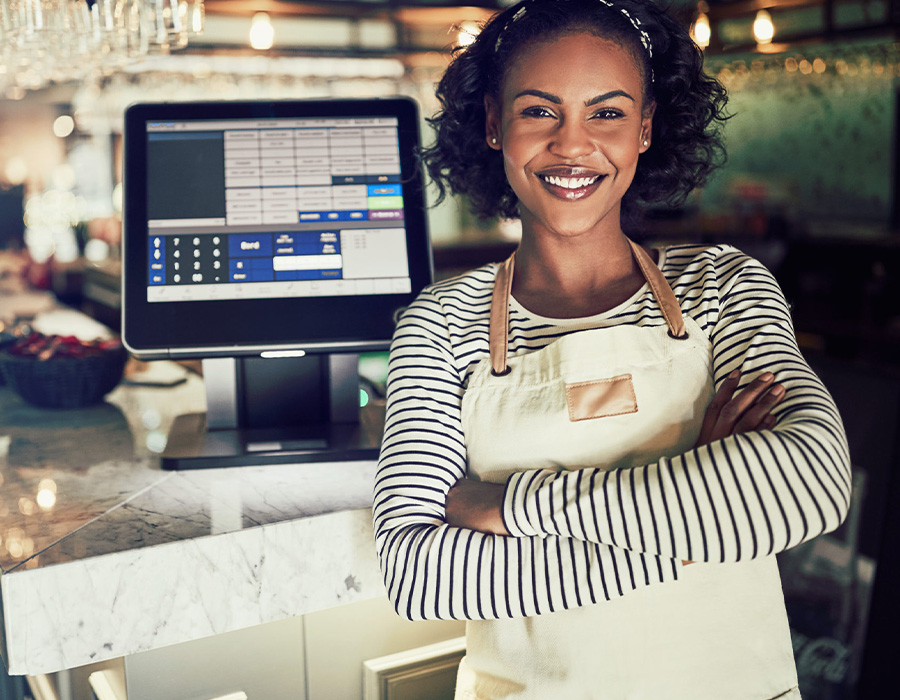 restaurant server standing at pos station