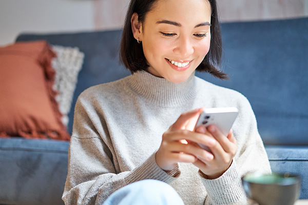 person at home on cell phone